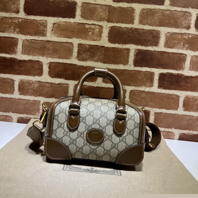 G*u*i top handle bags